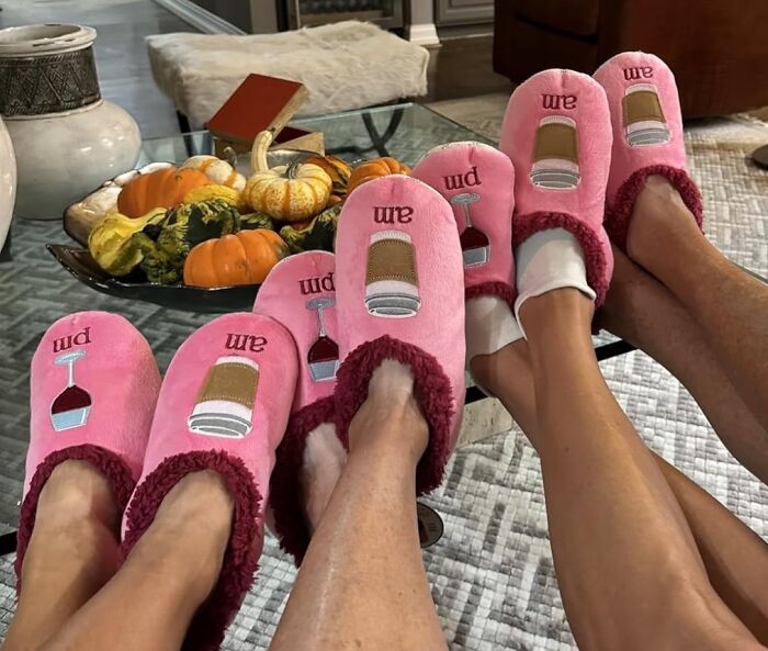 Matching pink slippers with wine glass and coffee cup designs, showcasing friendship gifts for Best Friends Day celebration.