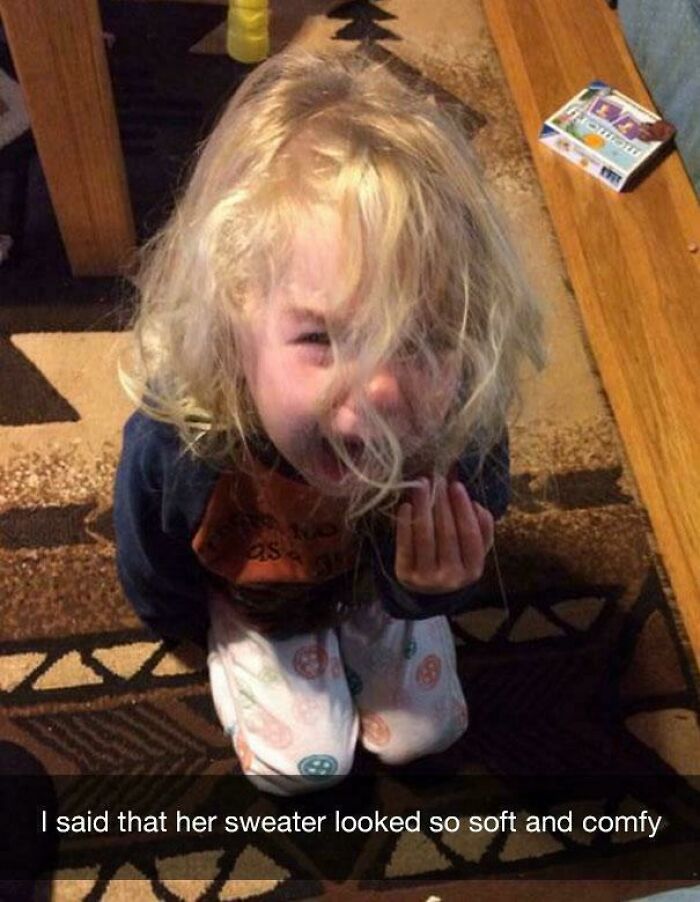 Young child with messy hair crying on a patterned carpet, capturing a hilariously unlucky parent moment at home.