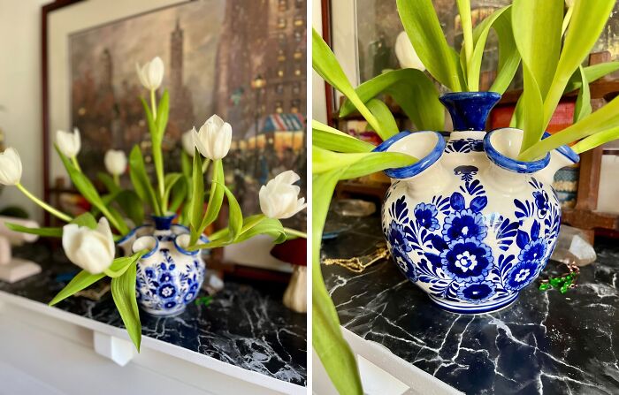 Blue and white thrifted vase with fresh white tulips displayed on a marble surface, showcasing weird and wonderful finds.