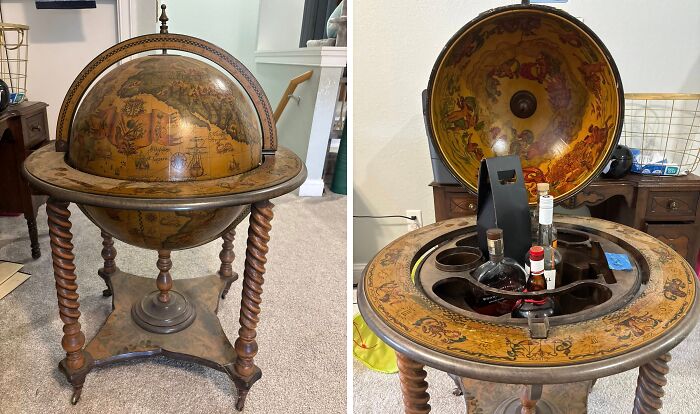 Vintage thrifted globe bar with detailed map design and wooden twisted legs, a weird and wonderful museum-worthy find.