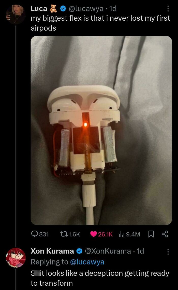 Exposed AirPods charging case showing internal components, creating a double take moment with interesting tech details.