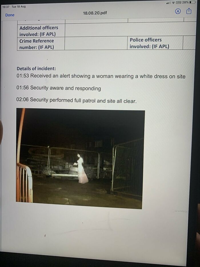 Security alert showing a possible ghostly figure in a white dress captured during a night patrol in chilling ghost encounters.