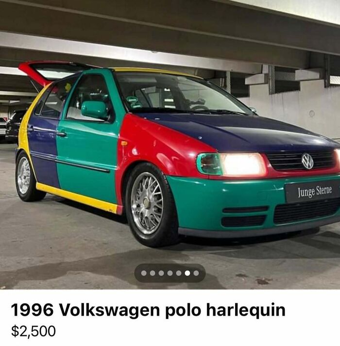 Multicolored 1996 Volkswagen Polo Harlequin parked in garage, one of the chaotic cars spotted for sale.