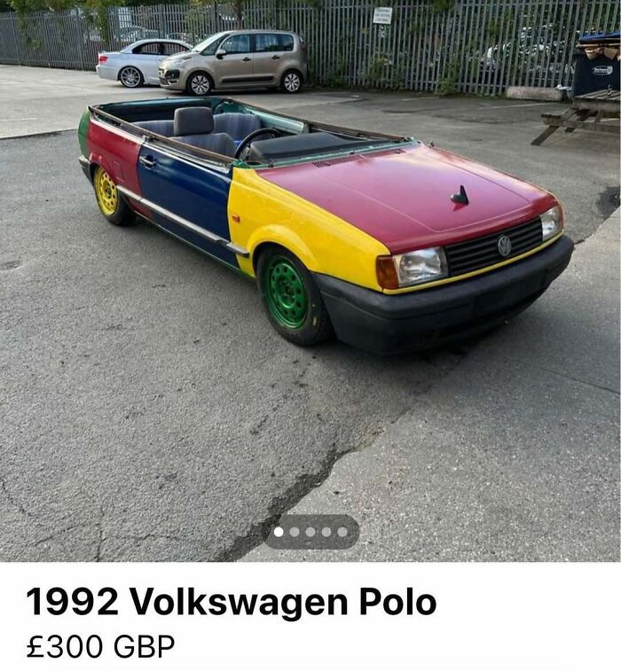 Multicolored 1992 Volkswagen Polo with missing roof and mismatched panels parked, one of 103 cars of absolute chaos for sale.