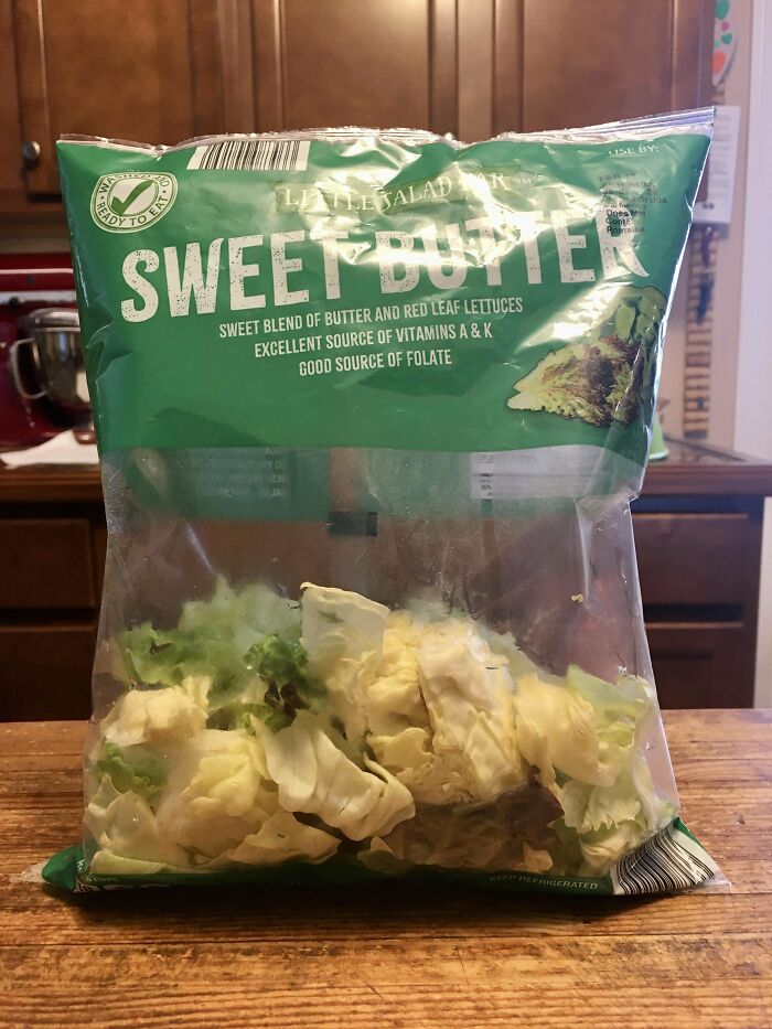Bag of Sweet Butter lettuce on a wooden table demonstrating easy life hacks for fresh produce storage.