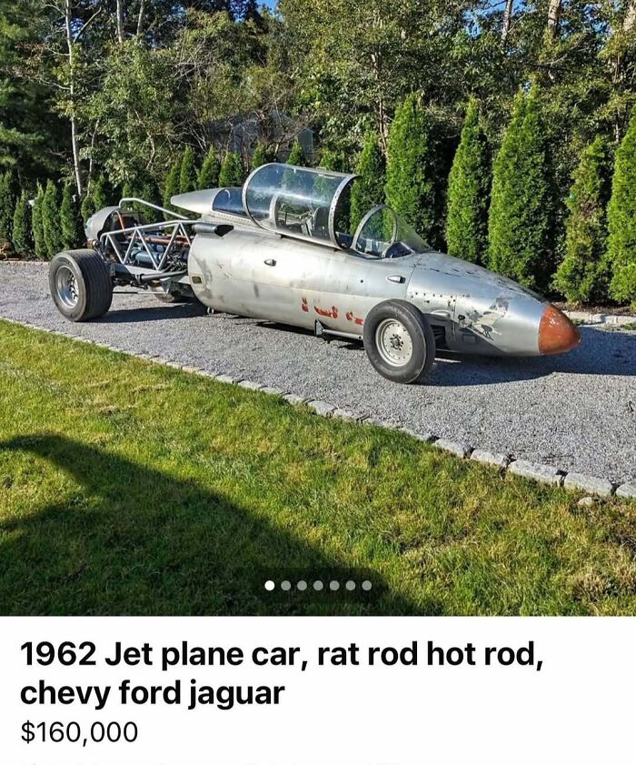 1962 jet plane-inspired car with rat rod design and hot rod elements parked on gravel path with greenery background for sale