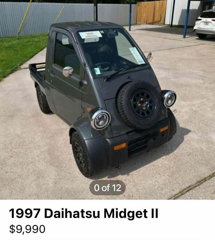 1997 Daihatsu Midget II compact car with spare tire on hood among 103 cars of absolute chaos spotted for sale.
