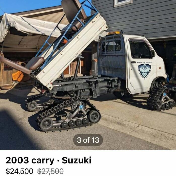 Modified 2003 Suzuki carry truck with tank-like tracks instead of wheels, featured among chaos cars for sale.