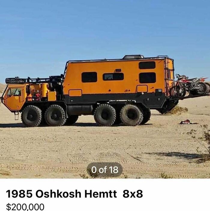 1985 Oshkosh Hemtt 8x8 truck with camper and motorcycles parked in desert, featured in cars of absolute chaos for sale.