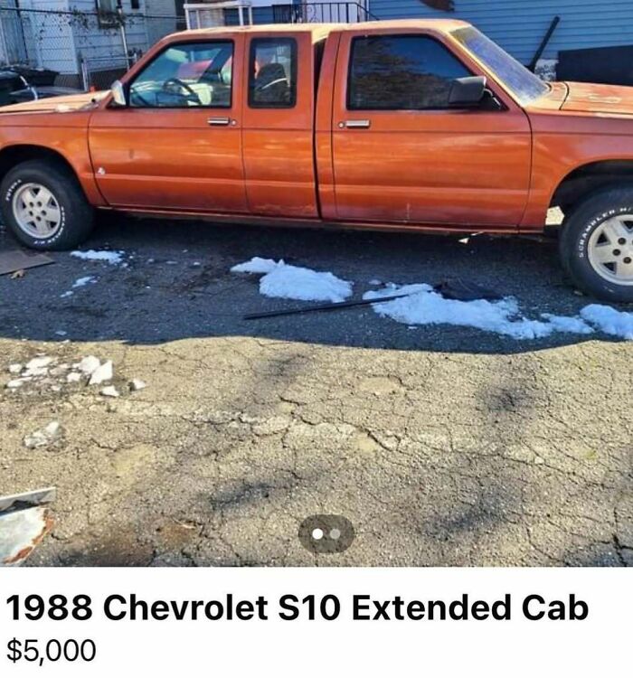 Orange 1988 Chevrolet S10 extended cab truck spotted for sale among 103 cars of absolute chaos collection.