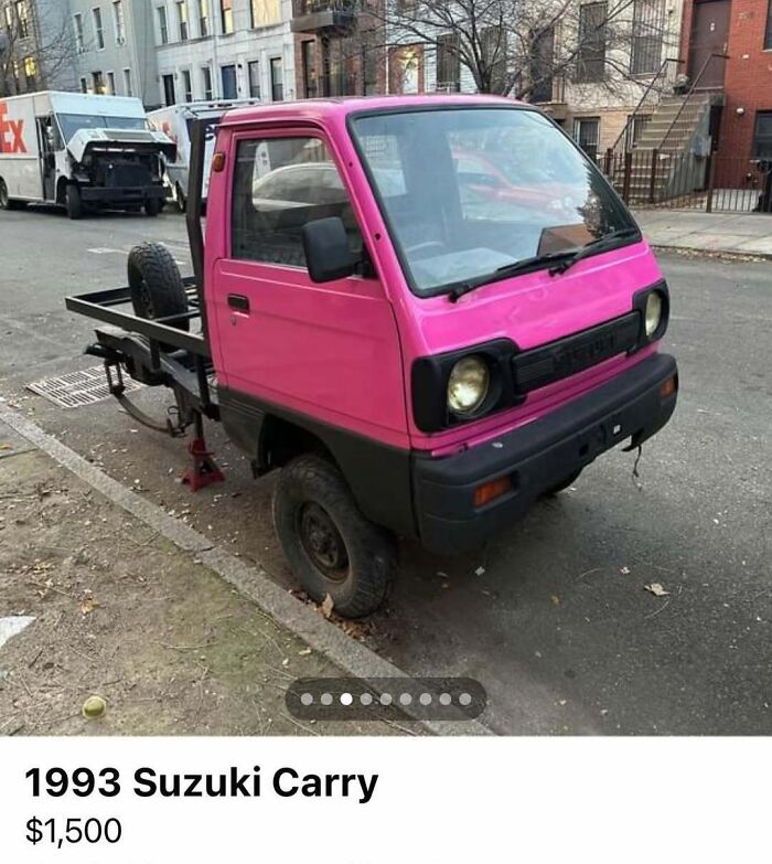 Pink 1993 Suzuki Carry in rough condition parked on street, one of the 103 cars of absolute chaos spotted for sale.