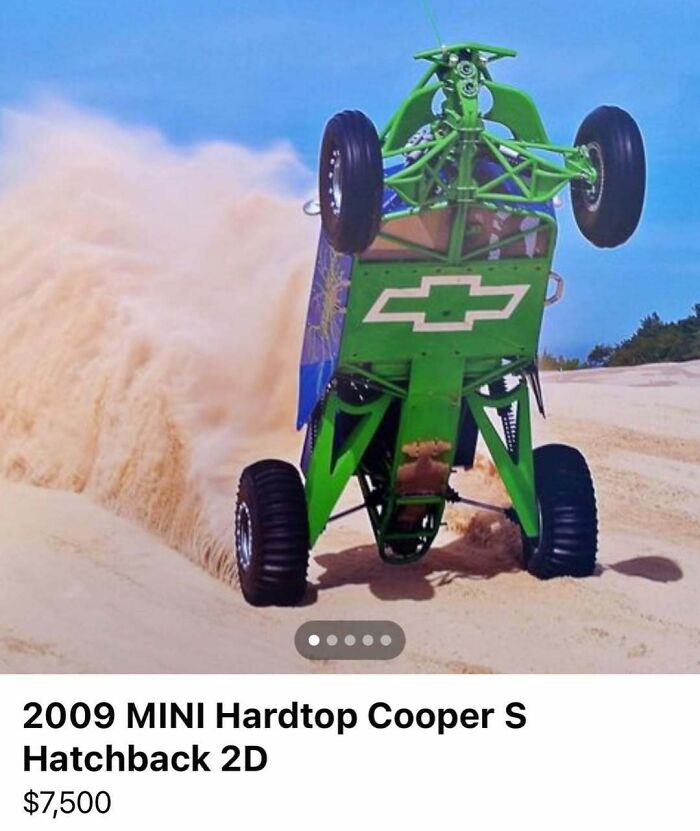Off-road vehicle performing a wheelie in sand dunes, showcasing cars of absolute chaos spotted for sale.