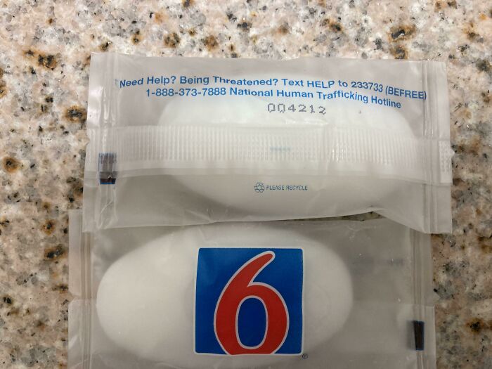 Small Motel 6 soap bar with human trafficking hotline information showcasing creative hotel design decisions.
