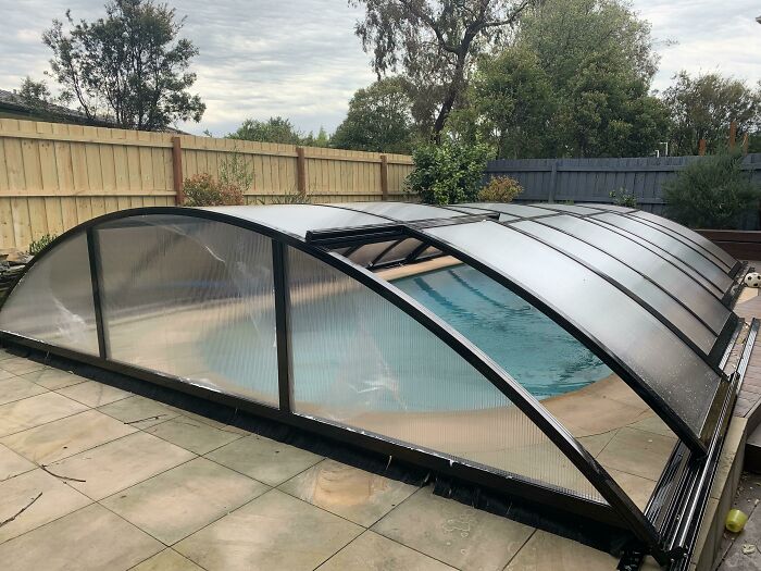 Retractable pool cover design showcasing creative hotel design decisions for safety and aesthetics in outdoor spaces.