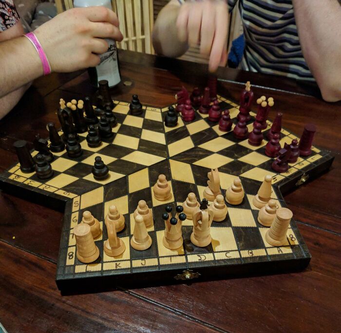Unique triangular chessboard design showcasing creative hotel design decisions beyond traditional game setups.