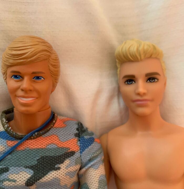 Two vintage dolls side by side showing how things used to look with distinct facial features and outfits.