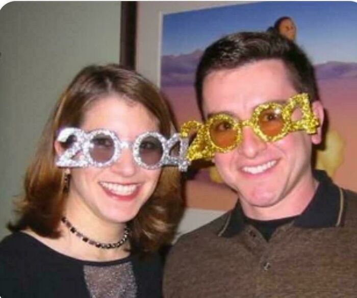 Two people wearing novelty 2004 glasses, smiling, illustrating how things have changed through the years online.