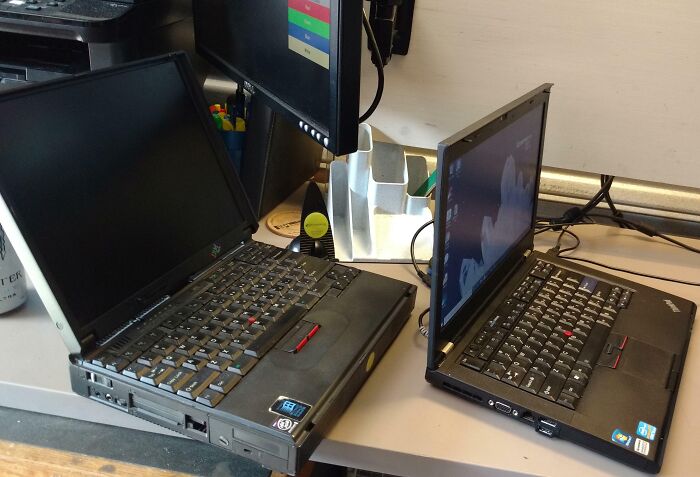 Two vintage laptops on a desk highlighting old technology in pics that perfectly portray how things used to look.