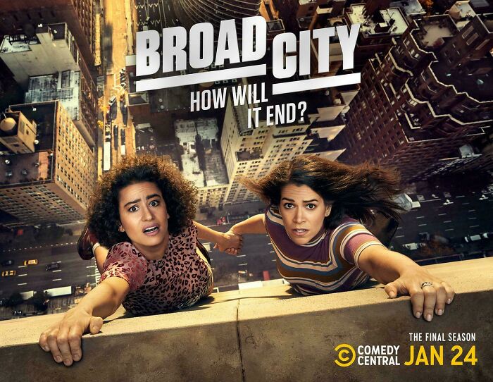 Two women hanging from a tall building edge, illustrating dramatic changes through the years according to people online.