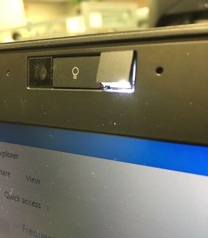 Close-up of a laptop webcam with a sliding cover, illustrating how things used to look for privacy protection.