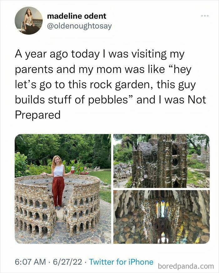 Woman exploring a detailed rock garden with pebble structures, showcasing creative outdoor art and daily serotonin boost.