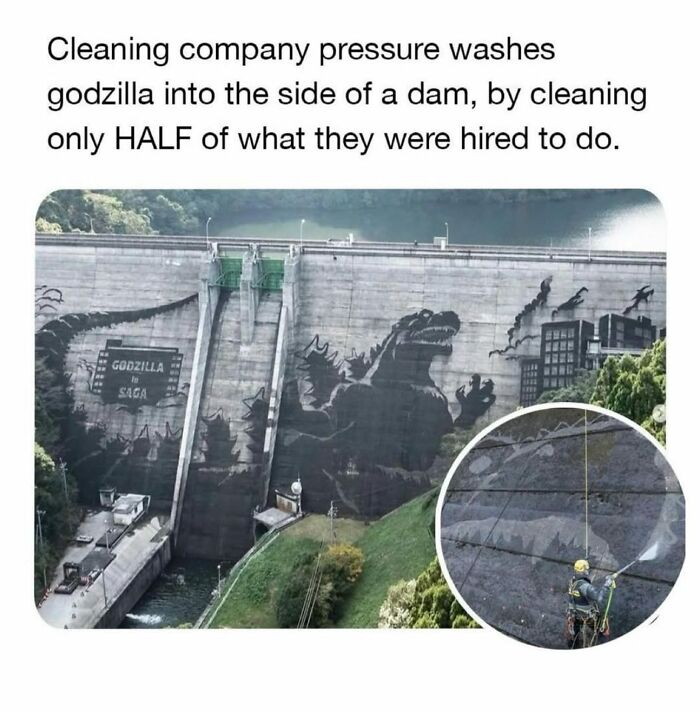 Pressure washing reveals a hidden Godzilla mural on a dam, showcasing secret facts through this amazing picture.