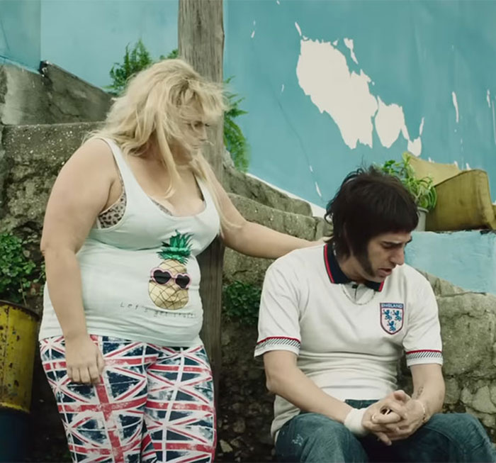 Scene from a film with two characters outdoors, relating to Isla Fisher amid tension with Sacha Baron Cohen divorce news. Scene from a film with two characters outdoors, relating to Isla Fisher amid tension with Sacha Baron Cohen divorce news.