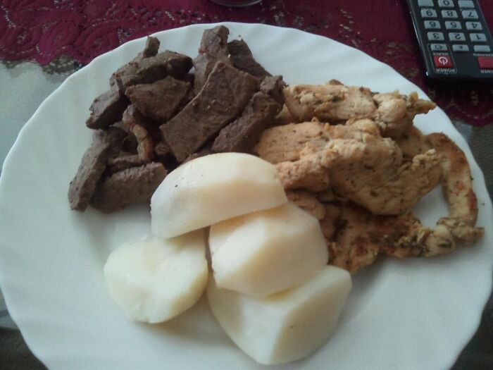 Plate of oddly shaped cooked meat and white starchy pieces, a cursed food pic that may require a trigger warning.