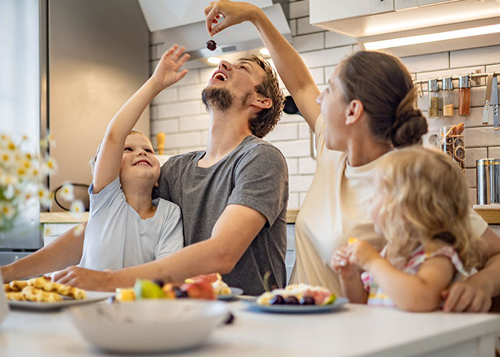 A family enjoying a meal together, highlighting themes of child care and the impact of CPS intervention.