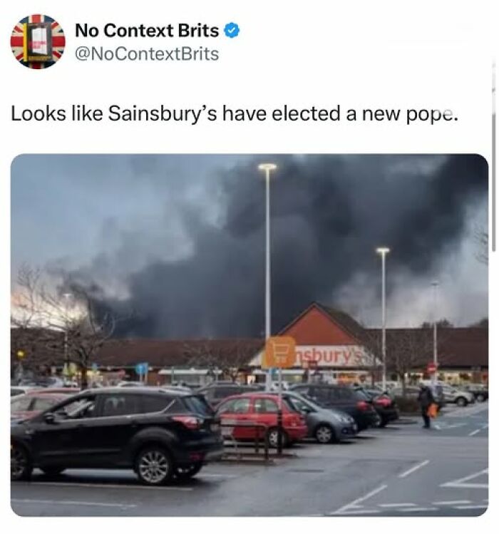British comedy tweet shows Sainsbury’s parking lot with large smoke cloud resembling a hat, highlighting British humor.