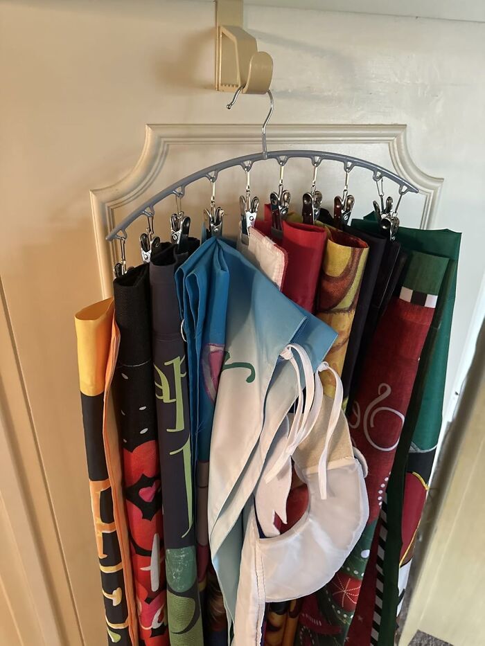 Organized fabric and cloth items hanging neatly on a multi-clip hanger, illustrating ways to ditch the slob life.