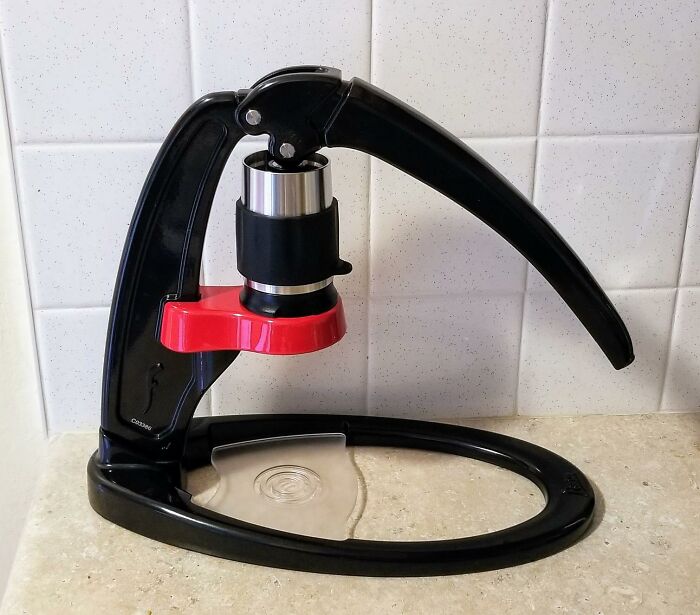 Manual espresso maker on a kitchen counter, an ideal unique Father's Day find to skip the socks this year.