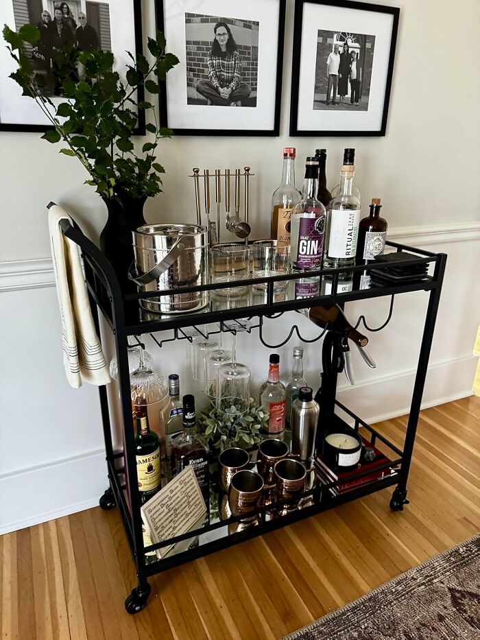 Stylish home bar cart with drinks, glassware, and decor, creating a cozy and inviting happy place at home.