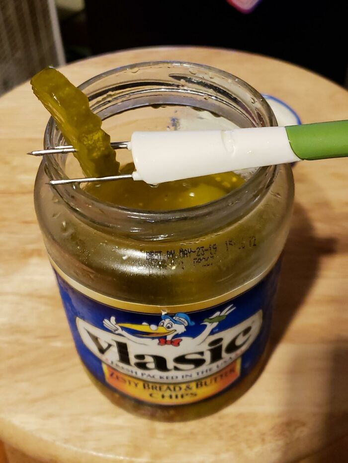 Jar of Vlasic pickles with a green and white dual-pronged fork lifting a pickle slice, perfect Father's Day gifts idea.