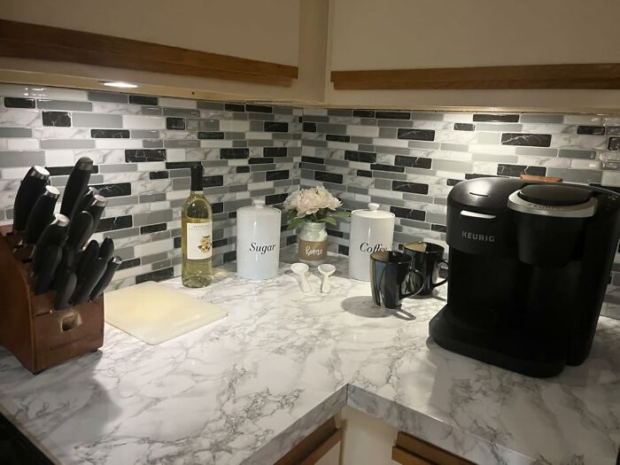 Modern kitchen countertop and backsplash showcasing home upgrades for weekend quick renovation wins.