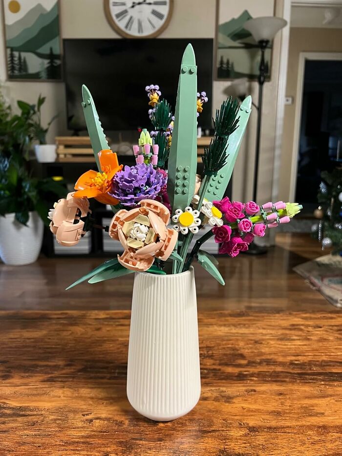 Colorful LEGO flower arrangement in a white vase, showcasing a creative hobby where trying your best is the key skill.