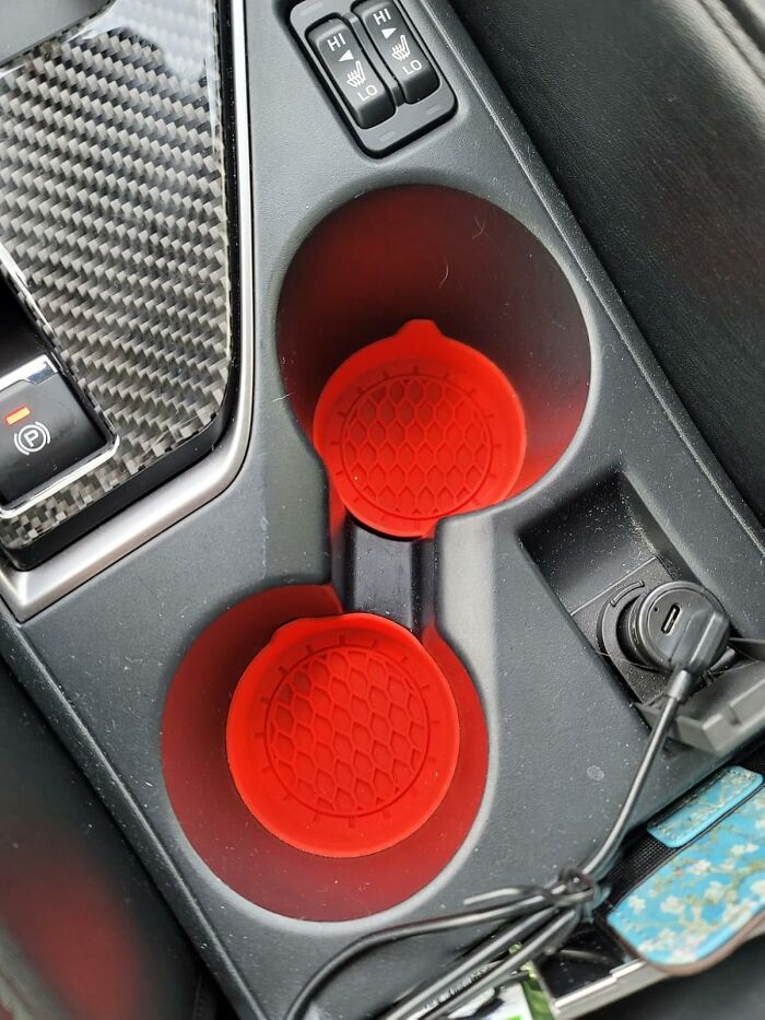 Car cup holders with red non-slip silicone mats, a popular affordable find on Amazon for vehicle organization and convenience.