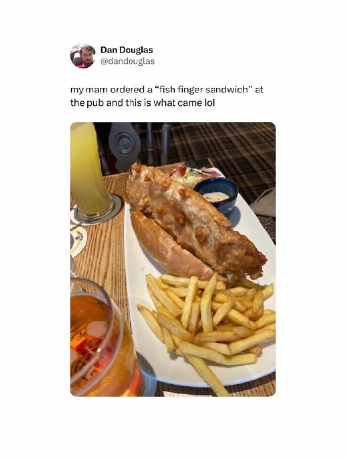 British comedy post showing a humorous fish finger sandwich with fries and drinks at a pub table.