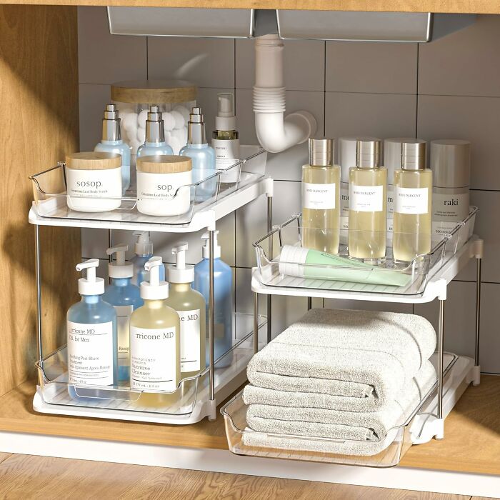 Clear countertop organizers holding skincare bottles, lotions, and towels, popular Amazon finds on many wishlists.