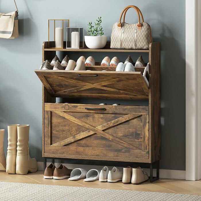 Organized wooden shoe rack with shoes and decor, illustrating a clutter-free space to ditch the slob life and start organizing.