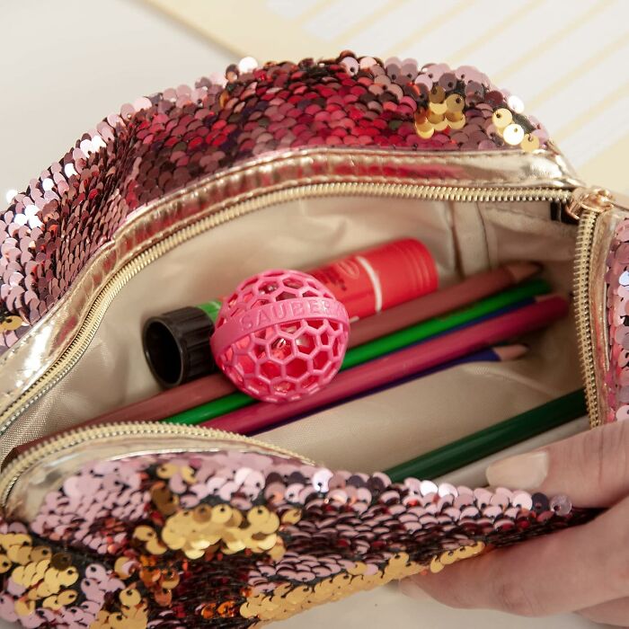Sequin pouch filled with colored pencils and accessories, perfect finds for people who want to nail adulting.