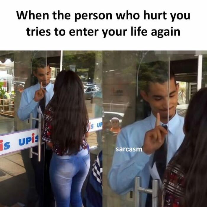 Man behind glass door putting finger up to block woman, illustrating hilarious memes about avoiding people who hurt you.