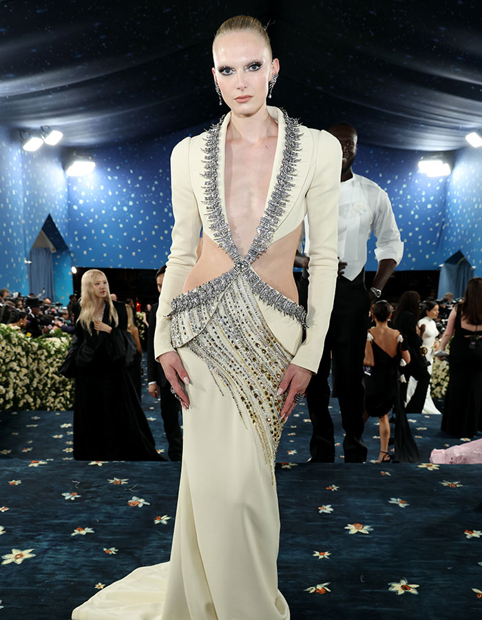 Model in an avant-garde gown with silver embellishments at the event showcasing biggest fashion fails from Met Gala 2025.