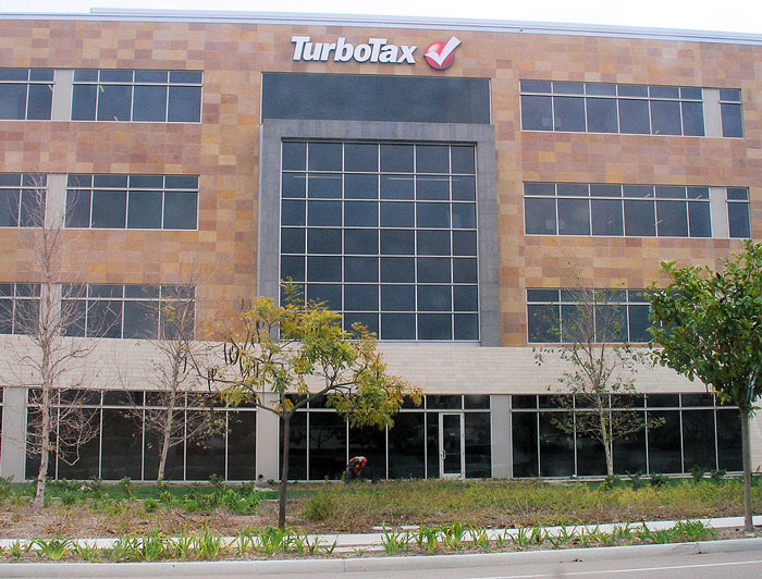 Office building with TurboTax logo, representing financial software linked to ways people lose money while saving.