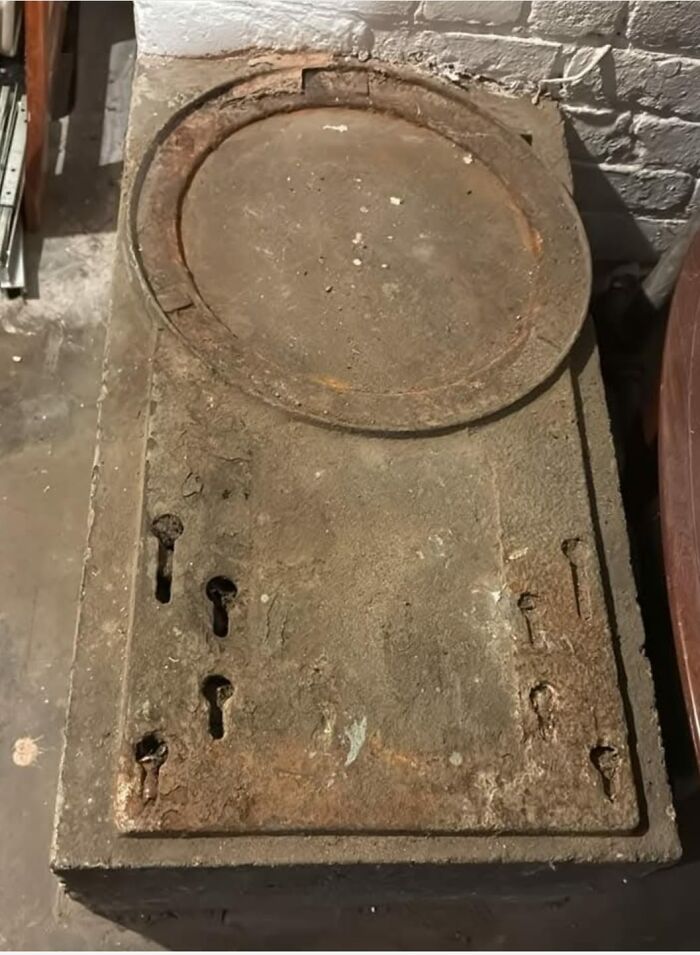 Rusty old metal safe with multiple keyholes found in a home with a hidden and forgotten past.