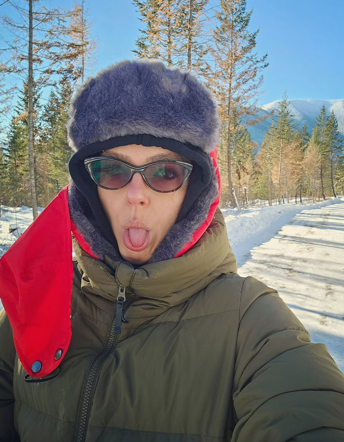 Person wearing winter coat, furry hat, and sunglasses outdoors in Montana, reflecting on America's Next Top Model winner experience. Person wearing winter coat, furry hat, and sunglasses outdoors in Montana, reflecting on America's Next Top Model winner experience.