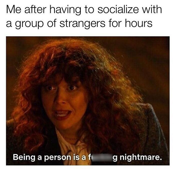Woman with curly red hair looking exhausted, illustrating a relatable funny parenting meme about socializing struggles.