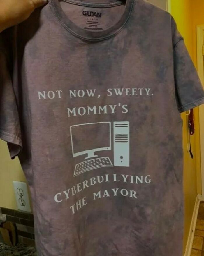 Brown t-shirt with a funny relatable meme text about cyberbullying and computer humor.