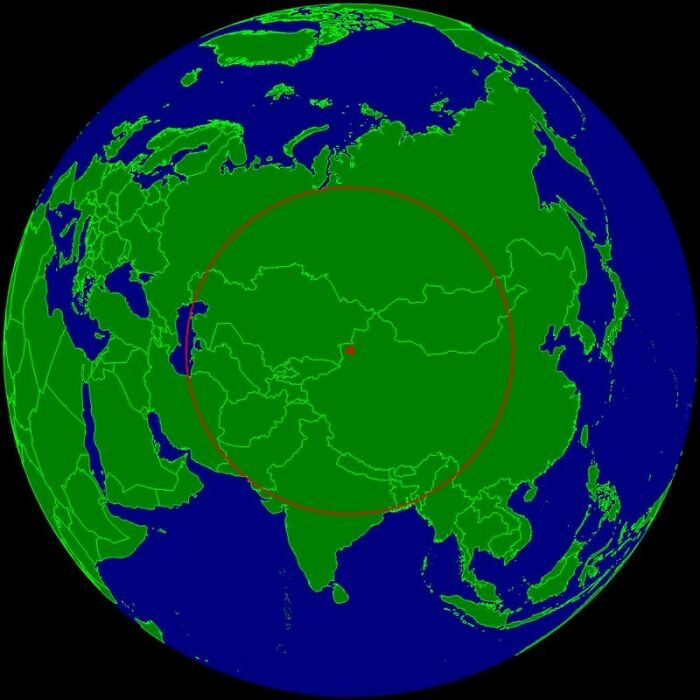 Globe map showing a large circle centered in Asia with country borders highlighted in green and blue oceans.