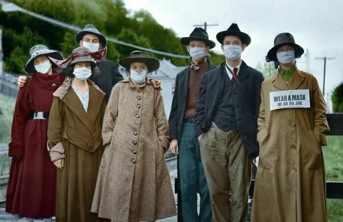 Group of people wearing vintage clothing and face masks, highlighting history up close through vintage photos.